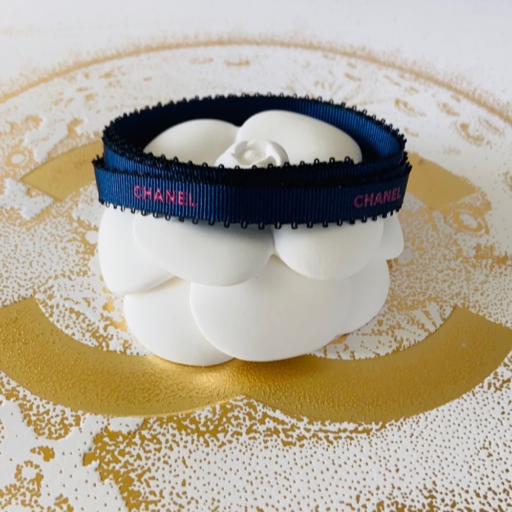 CHANEL Blue Color With Pink Embossed Lettering.